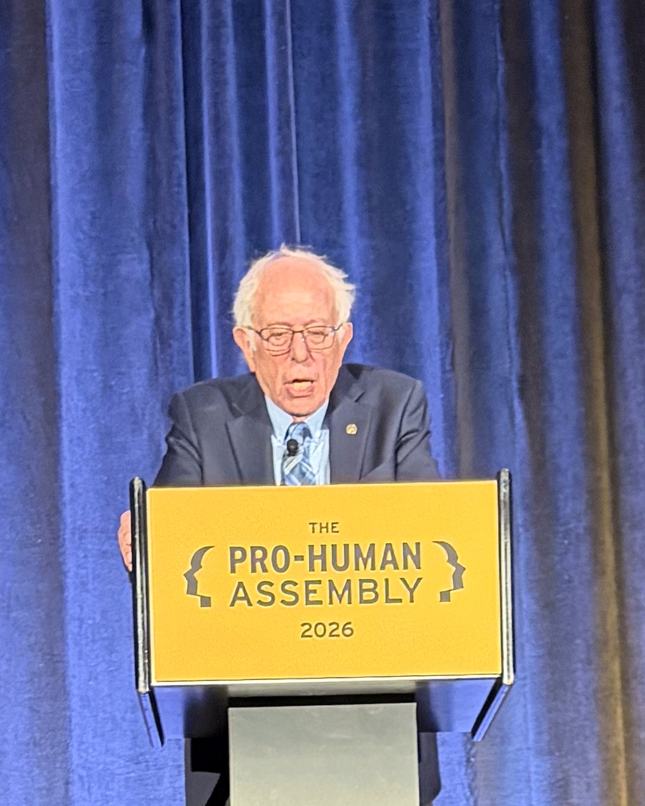 Sen. Bernie Sanders speaking at the Pro-Human Assembly podium.